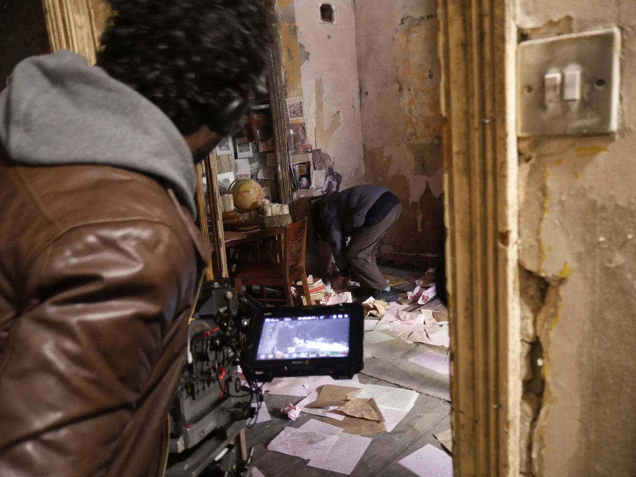 A camera operator frames a scene on the Universe25 set.