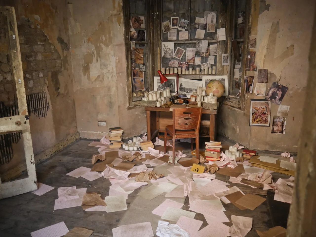 The paper-strewn room and dressing table on the Universe25 set.